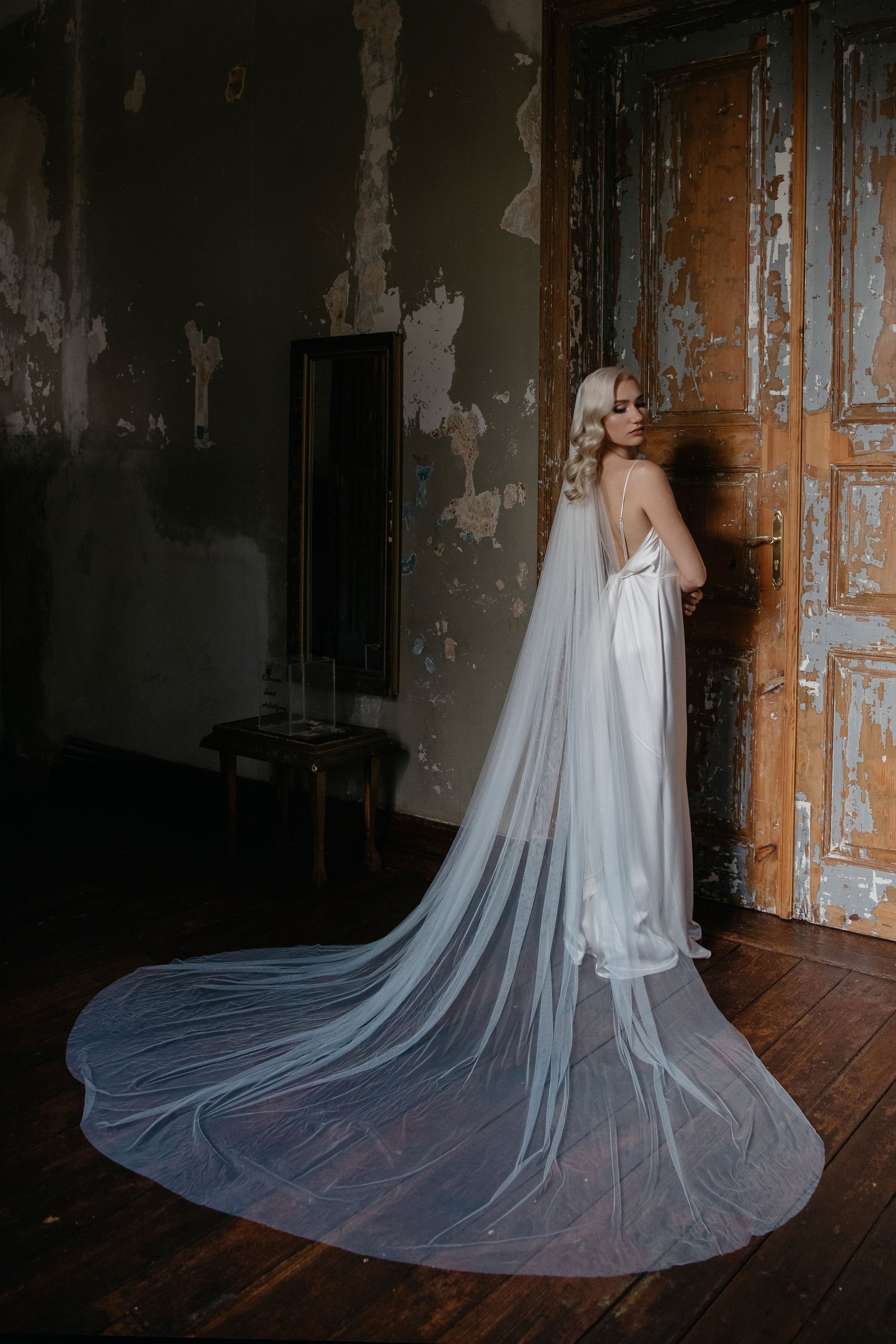 Back view of IRIS 300cm wide blue ombre veil, highlighting the airy volume and gathered comb attachment.