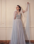 IRIS blue ombre wedding veil in soft English tulle, featuring a custom dip-dyed gradient from ivory to dusty blue with a 300cm wide chapel length silhouette.