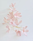 Blush pink hand-dyed velvet floral hair accessory, showing custom color matching.