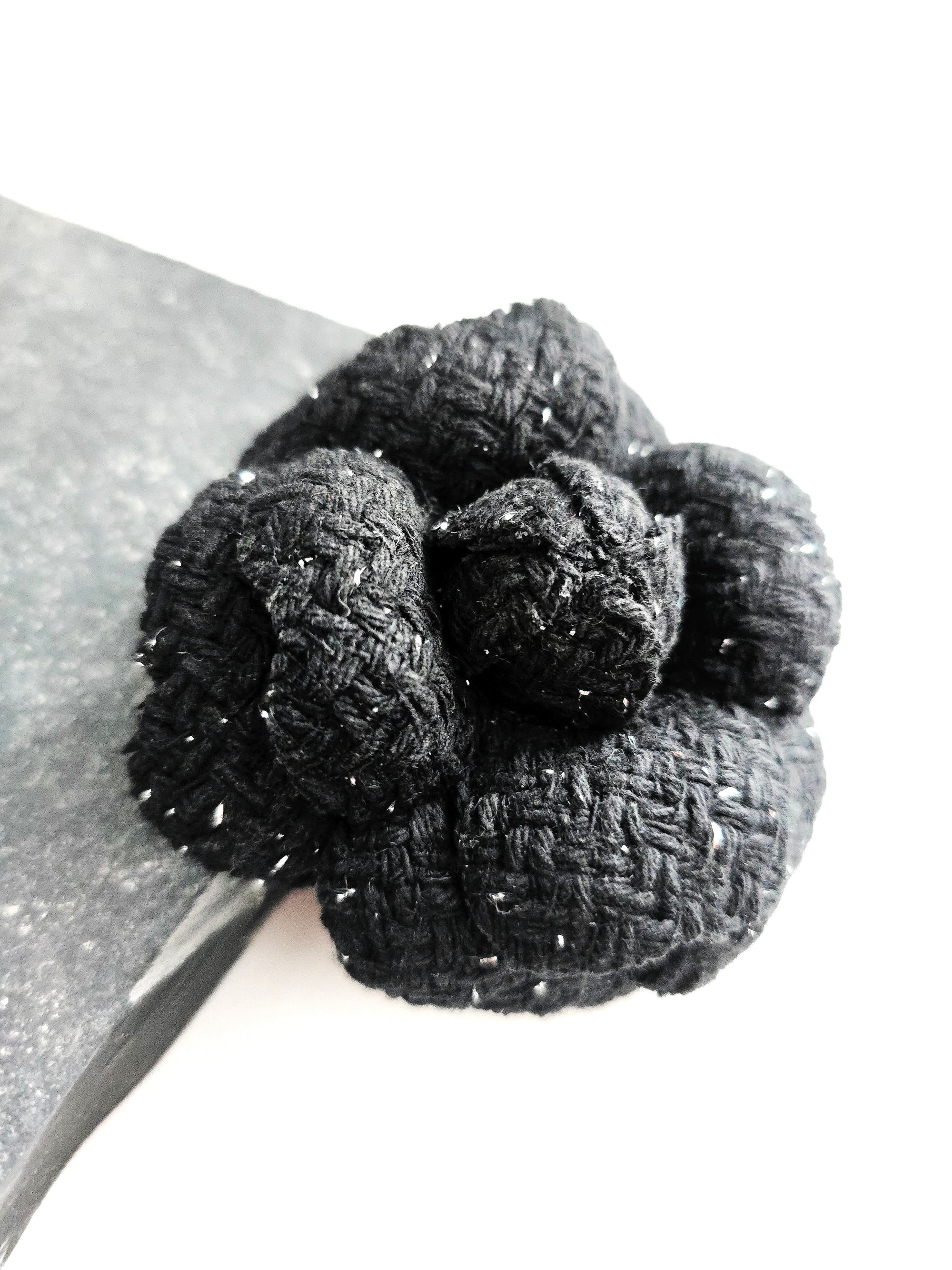 Handmade black tweed camellia brooch with subtle silver sparkles, textured fabric flower pin for blazer or coat