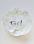 Ivory camellia brooch with pin fastening on back