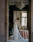 IRIS blue ombre wedding veil in soft English tulle, featuring a custom dip-dyed gradient from ivory to dusty blue with a 300cm wide chapel length silhouette.