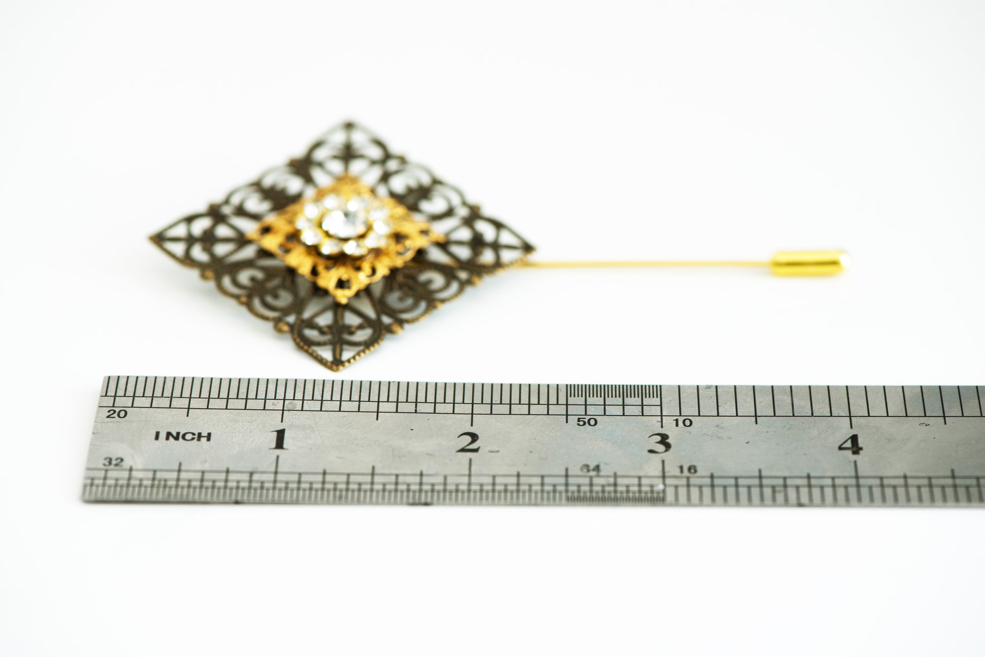 VERITAS sacred geometry wedding boutonniere in brass with glass crystals