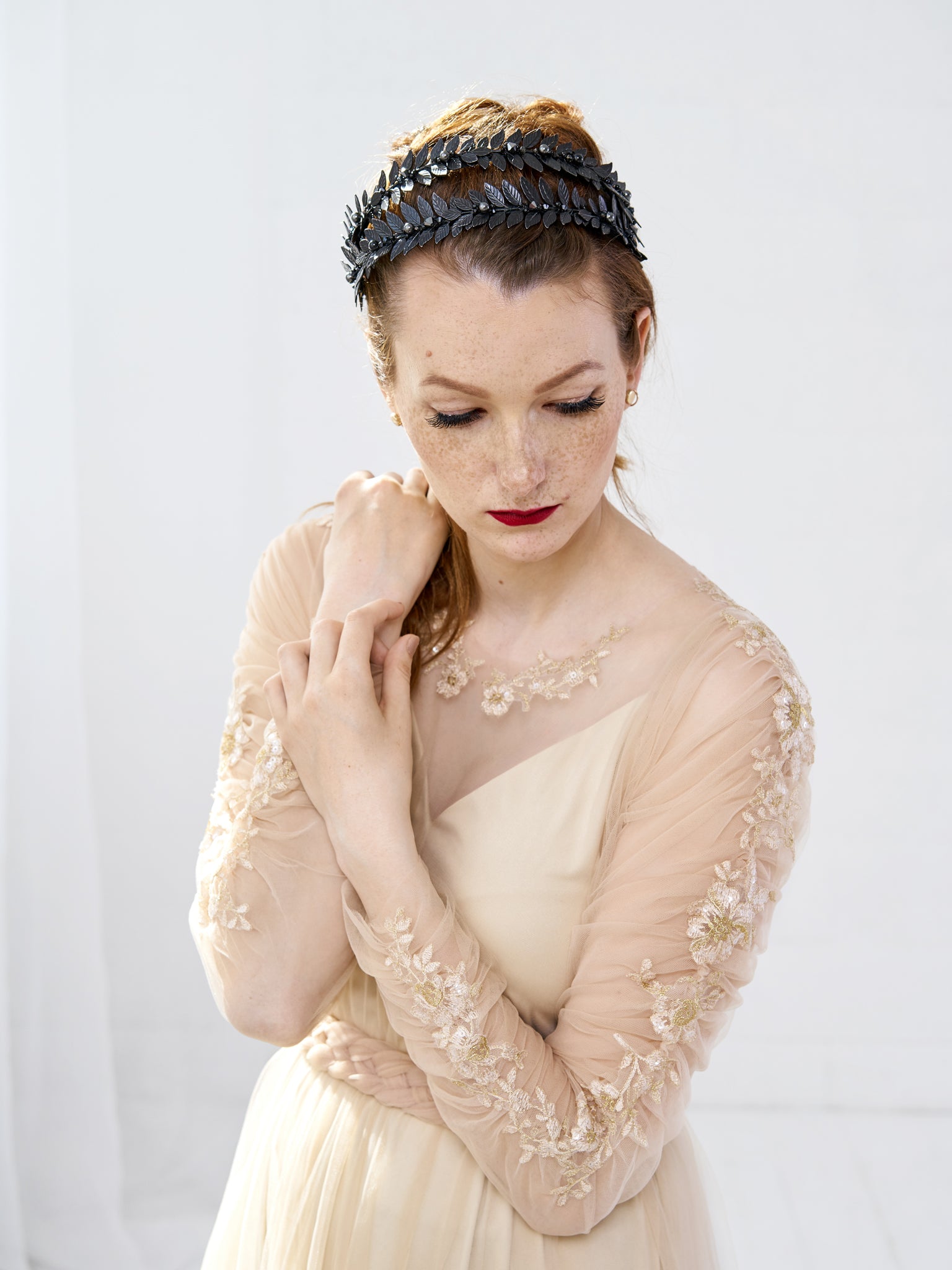 Frontal view of the MARIA gothic wedding tiara showcasing the architectural height of the double headband and the seamless integration of black crystals.