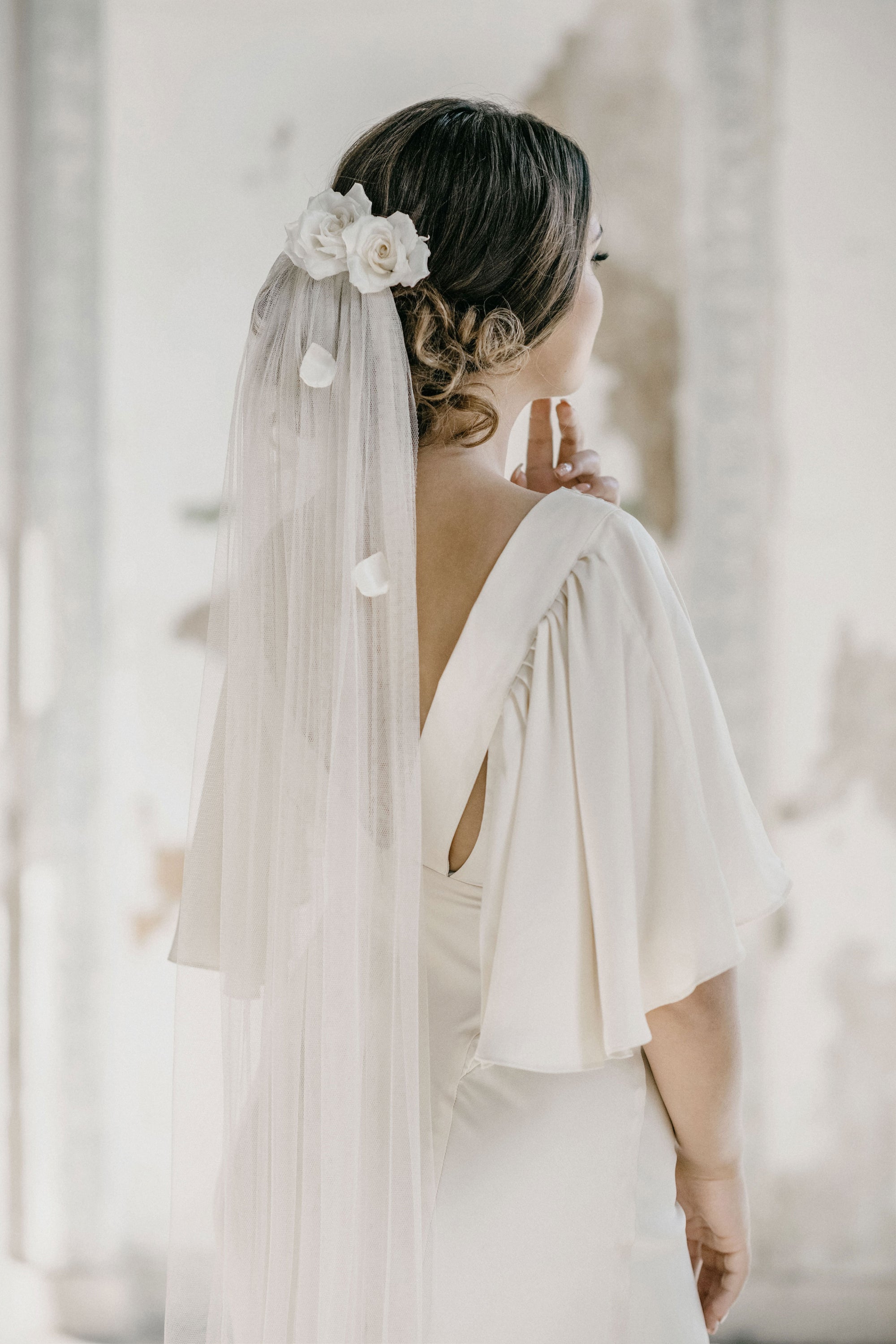 bride with soft English petal veil and silk roses