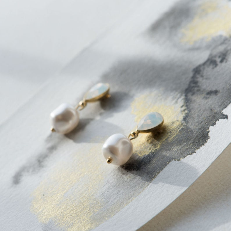 Close-up of PERELLA baroque pearl bridal earrings with crystal accents
