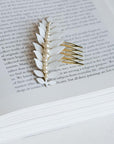 Hand-enameled laurel leaf branch with pearl details on a gold-tone bridal hair comb