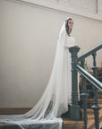 Bride wearing HARRIET wide cathedral veil made of soft English tulle, flowing in natural light.