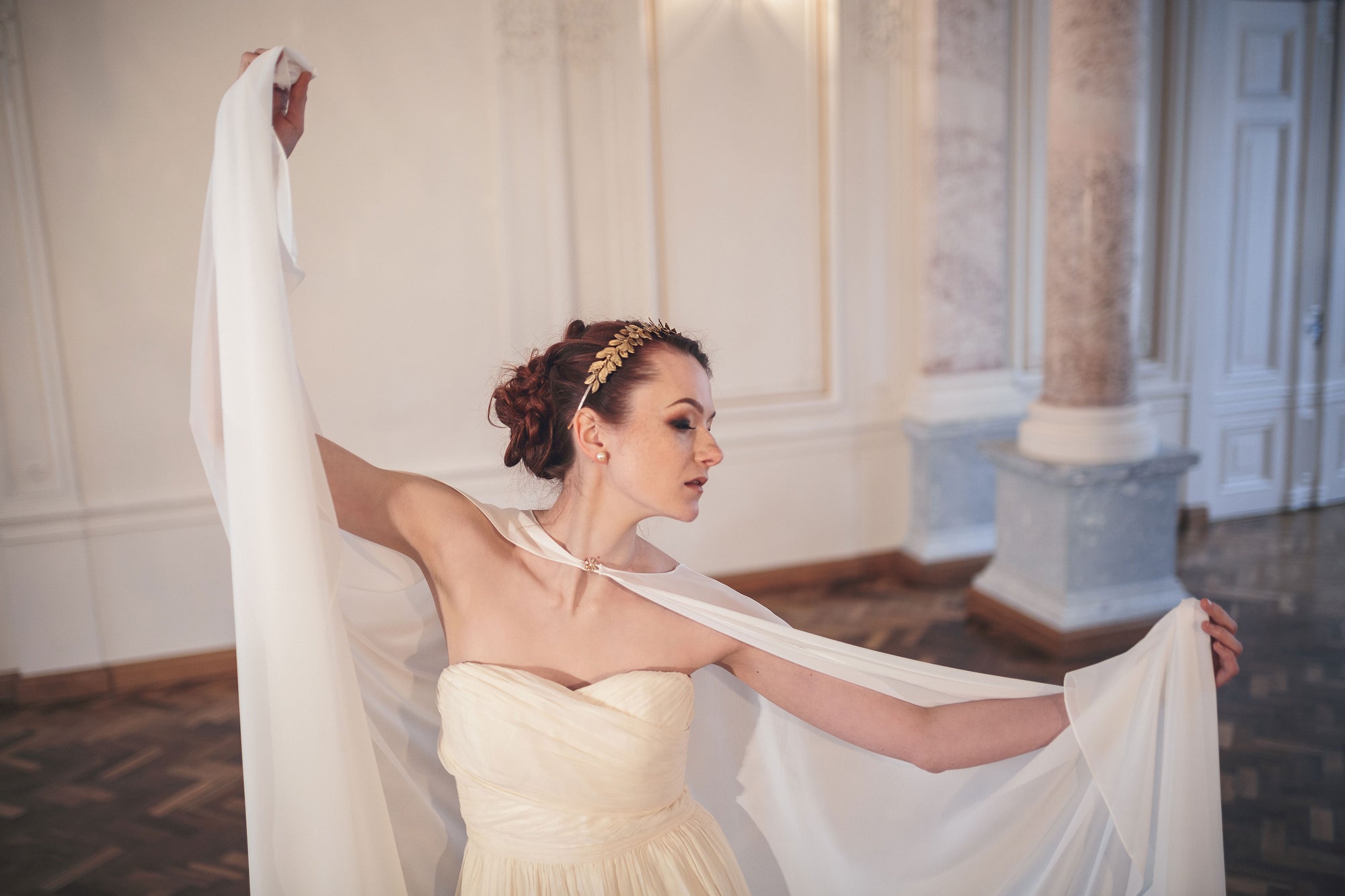 CLOTILDE laurel leaf wedding headband styled with romantic bridal gown