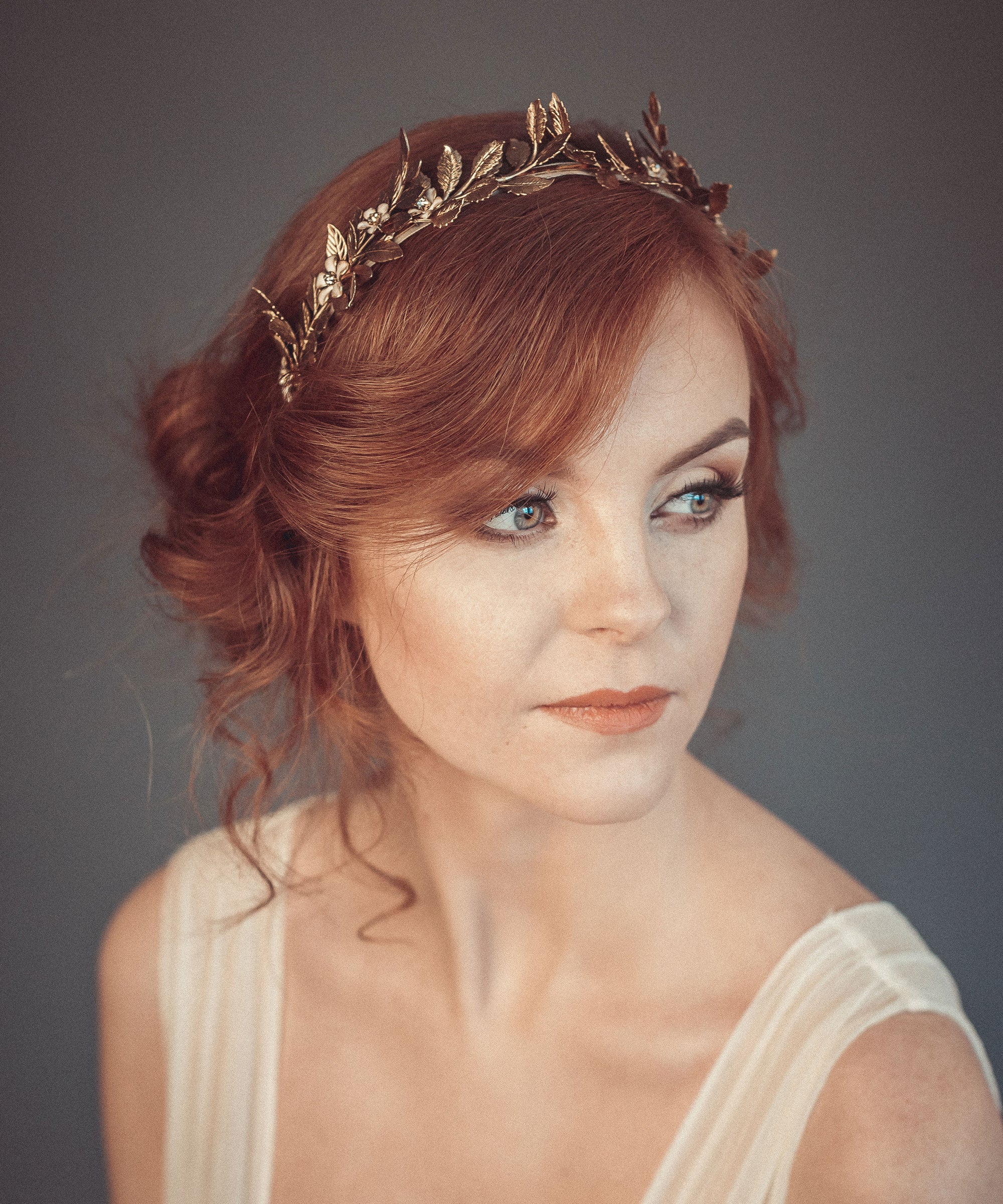 Gold laurel leaf bridal crown worn by bride, Greek goddess inspired headpiece