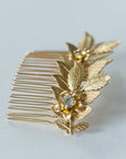 Botanical gold hair comb with leaf and  gold flower design with rhinestones in center