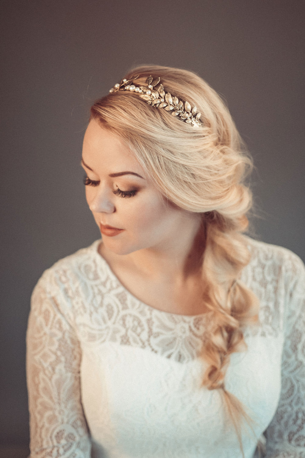 Close-up of CARPO bridal headband showing curated brass oak leaves and hand-wired pearls for a minimalist botanical look.