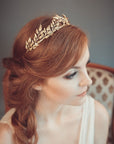 Bride wearing DAPHNE lightweight gold leaf headband inspired by ancient Greece, ideal for boho weddings