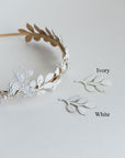 Side-by-side color comparison of VICTORIA bridal headband finishes: Hand-painted Matte White vs. Soft Ivory lacquer on gold brass leaves.