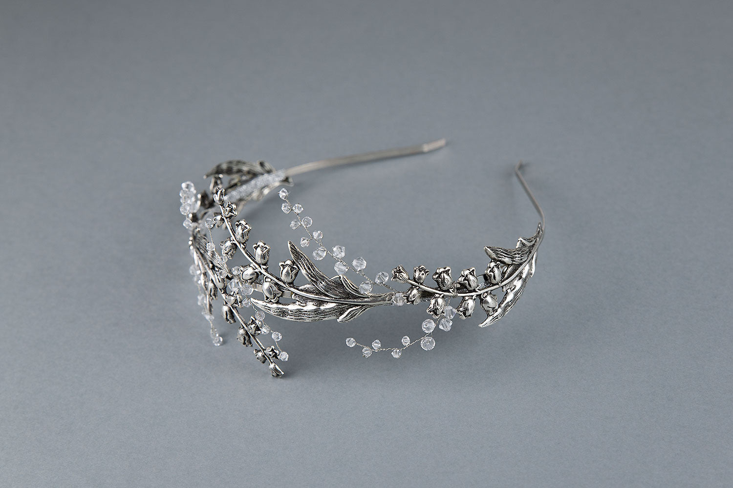 Silver lily of the valley bridal crown with Austrian crystals, handcrafted metal headband for weddings.