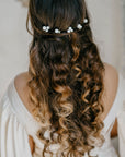 ALSA bridal pearl hair pins styled in romantic boho hairstyle

