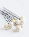 Close-up of ALSA pearl pins set for weddings