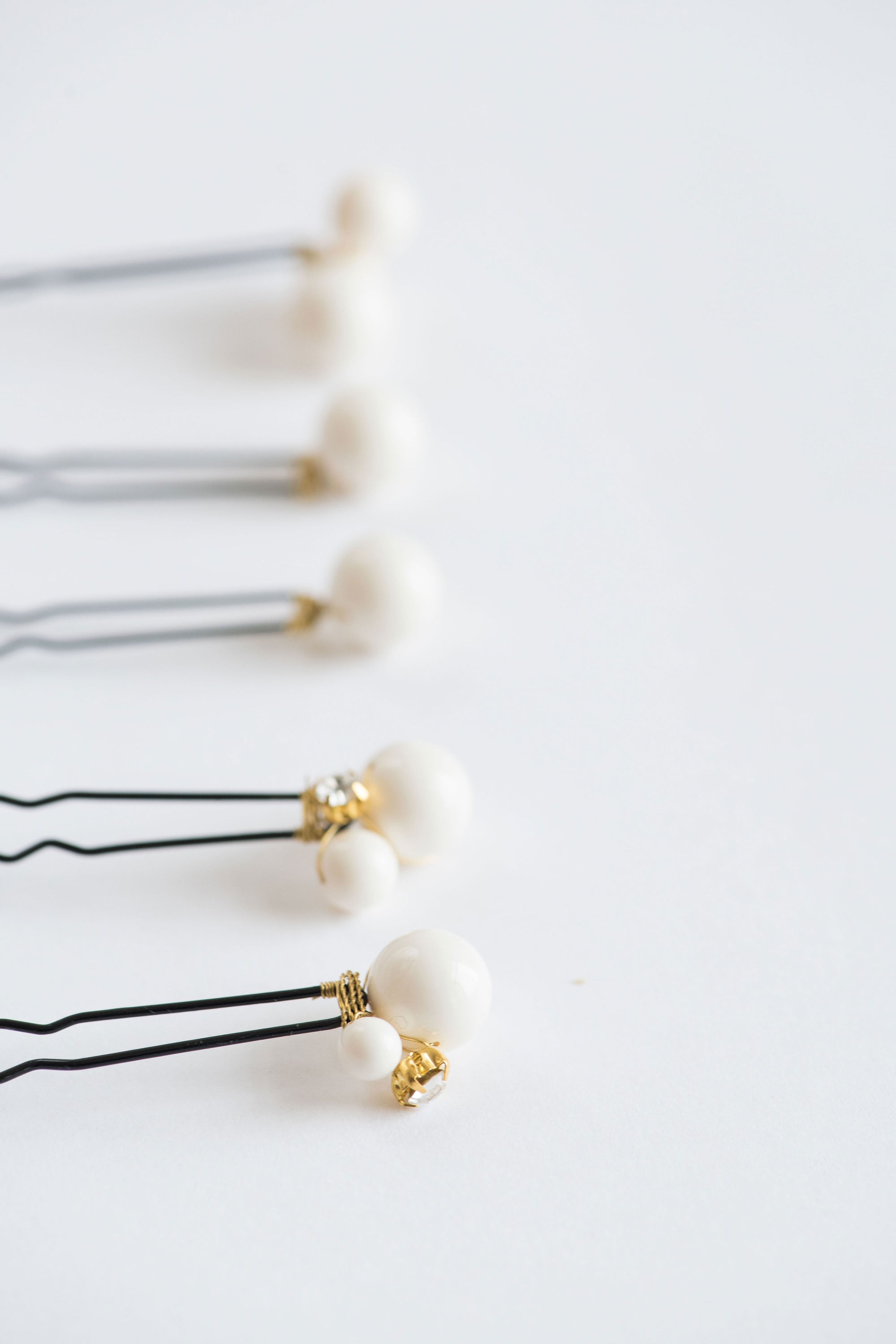 Close-up of ALSA pearl pins set for weddings