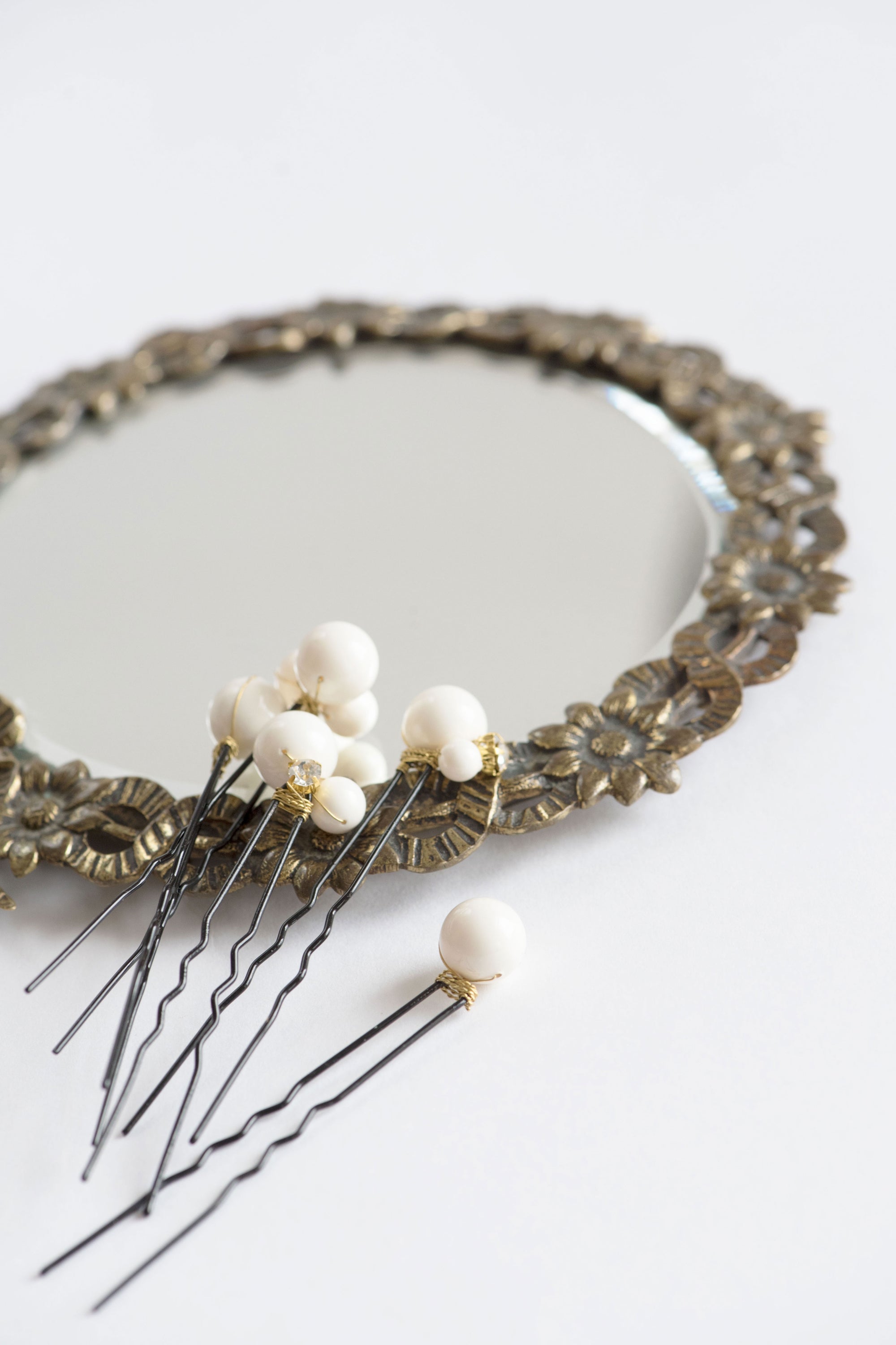 ALSA bridal pins styled on vintage mirror