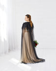 Bride wearing RAVEN black wedding cloak with feather lace and black rhinestones