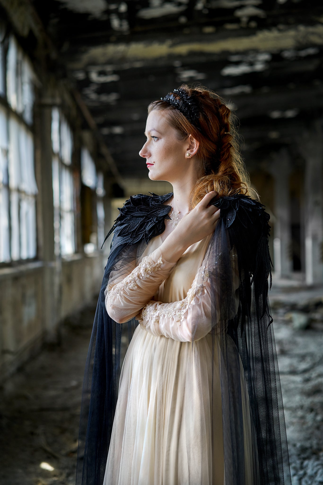 black wedding cloak on bride shoulders