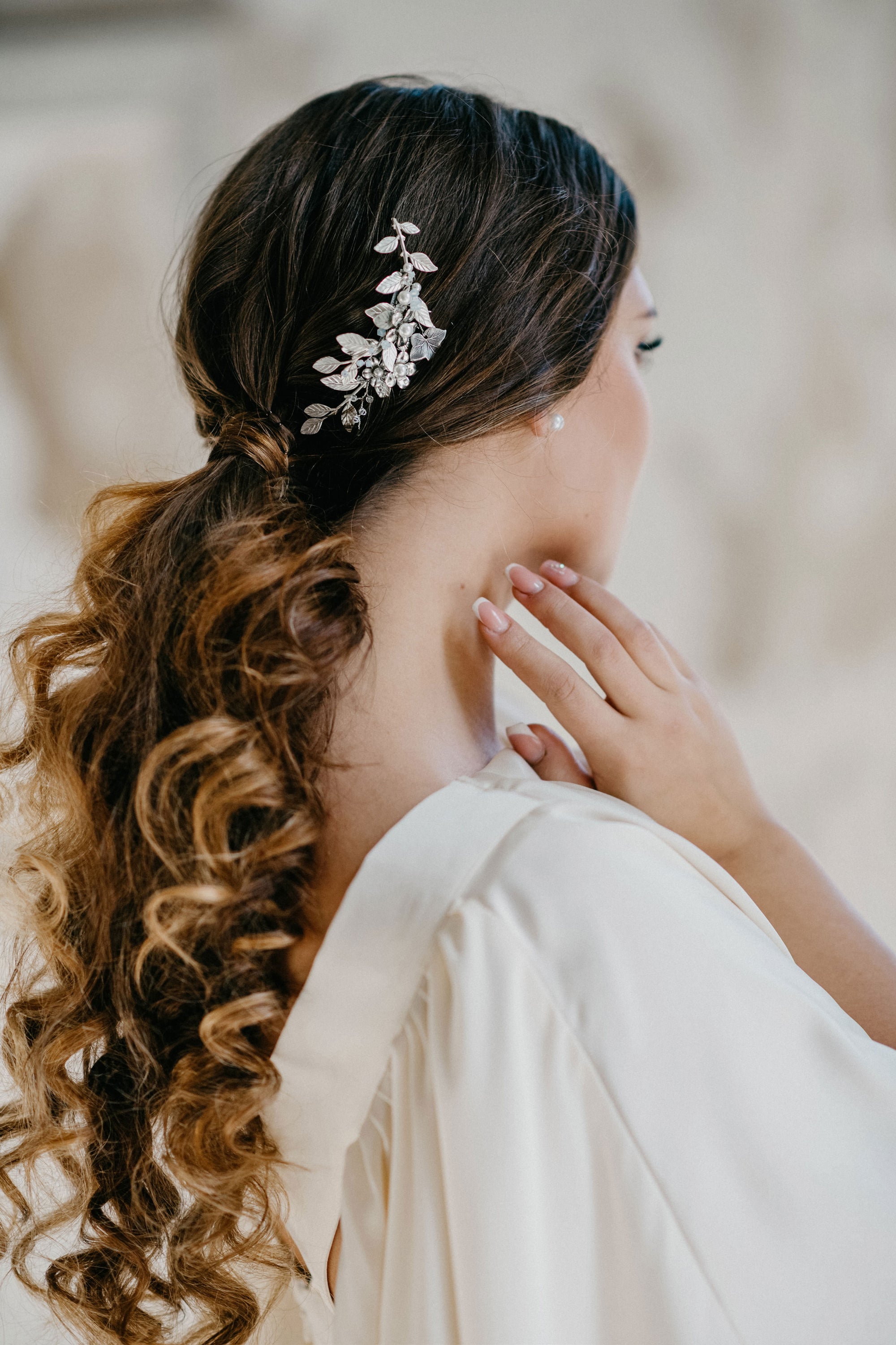 Model wearing TILLE silver leaf bridal hair comb with pearls and crystals
