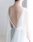 Soft English tulle bridal cape veil draped over shoulders, minimalist veil alternative for modern bride